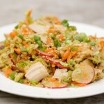 Whisk dressing again and drizzle over the salad, toss to evenly coat.