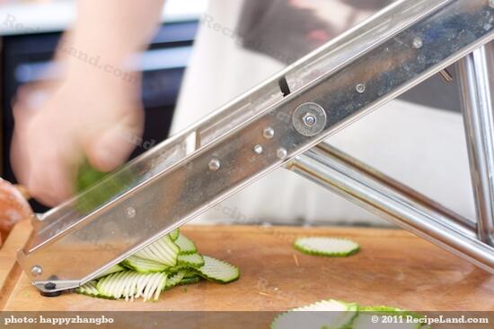 Slice the zucchini with a mandoline or by hand.