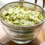 Let the colander sit over a large bowl to catch the water from zucchini.