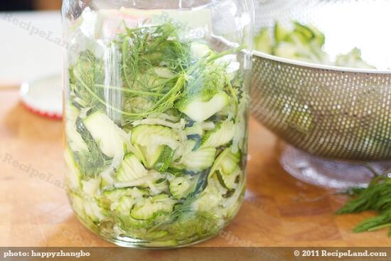 Place more dill sprigs, then add more zucchini-onion mixture... 
