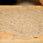 Roll the dough into a 12-inch circle on a lightly floured surface. 