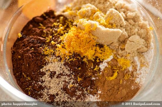 In large bowl combine flour, sugar, cocoa powder, grated orange peel, baking soda, cinnamon and nutmeg.