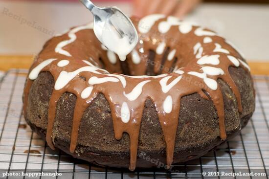 Drizzle the white (plain) glaze over chocolate glaze. Be creative!