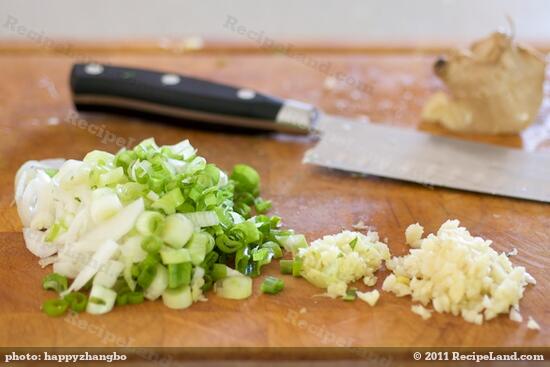 Then slice the scallions, finely chop or mince the garlic and ginger.