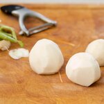 Peel the daikon or turnips.