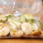 Place the daikon or turnip chunks and white part of the bok choy into a zip-lock bag.