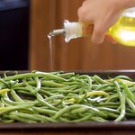 Spread the green beans on a large baking sheet with tin foil lined.