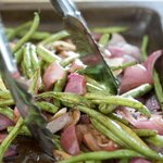 Pour the vinegar mixture over the beans and onions, with tongs stir the green beans and onions until evenly coated. 