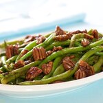 Arrange the green beans on the plate, sprinkle with toasted butter-maple pecans, and time to enjoy!