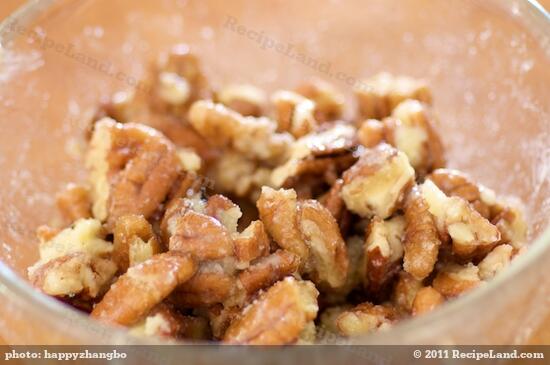 Toss until the pecans are well coated by butter and maple syrup.