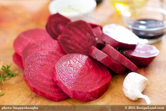 Peel the beets, and slice into 1-inch thick slices.
