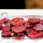 Toss beets in mixing bowl with garlic, thyme, balsamic vinegar, 2 tbsp olive oil and 1 tbsp lemon juice.
