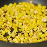 Stirring often, toast the corn for about 10 minutes until the corn turn into brown in spots. Set aside. 