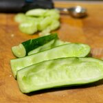 With a melon spoon get rid of the seeds of cucumber.