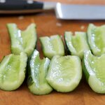 Peel cucumber and cut in half lengthwise, scoop out and discard seeds. 
