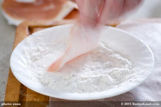 Dredge one side of each cutlet in the flour