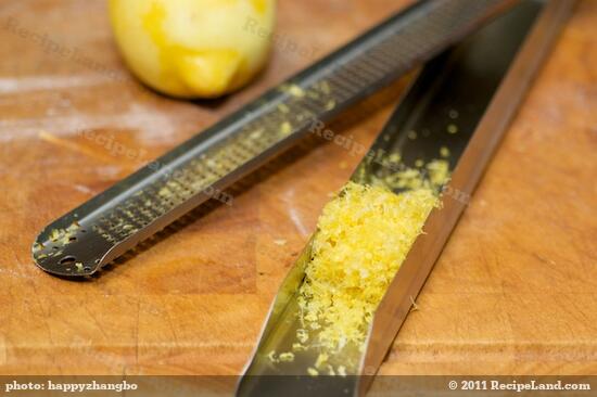 Freshly grate 1 lemon, and set aside.