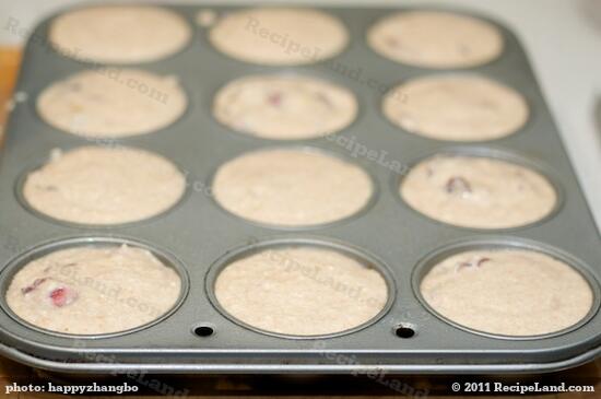 Divide the batter evenly among the 12 muffin cups.