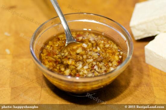 Add the soy sauce, rice vinegar, honey, lime juice, ginger, garlic, scallions if using, red pepper flakes to taste and sesame into a small bowl, and whisk until well combined. 