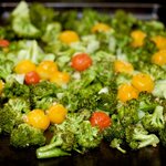 Bake at 450 degrees F oven until the broccoli starts to brown and the cherry tomatoes start exploding, about 11 minutes.