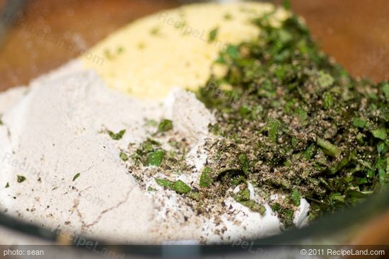 Add all the dry ingredients including herbs into a large bowl.