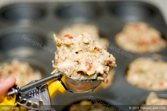 Spoon the batter into each muffin cup.