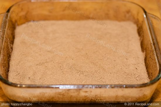 until all the mixture is finished, and the batter should be completely covered by the cocoa-sugar mixture. 