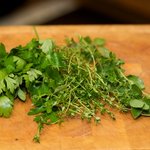 Meanwhile clean the herbs and finely chop them.