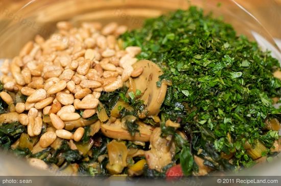 Remove from the heat, and transfer the vegetable mixture into a large bowl,