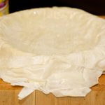 Coat a 9-inch pie plate with cooking spray or grease with butter. 