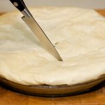 Stuff the edges into the sides of the pan to form a pie crust looking. 