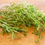 Chop up the fresh rosemary and thyme leaves.