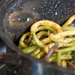 Transfer the green beans into a baking pan.