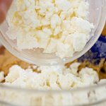Add the feta cheese into the flour-egg mixture.