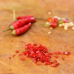 Add some fresh and seeded chili peppers if using.
