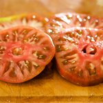 Slice the tomato into 4 thick slices (or more as desired).