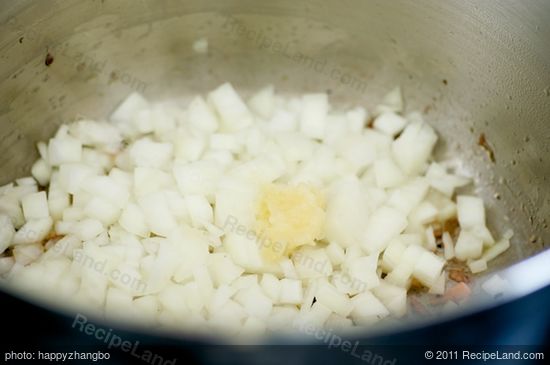 In a large pot, heat olive oil until hot.