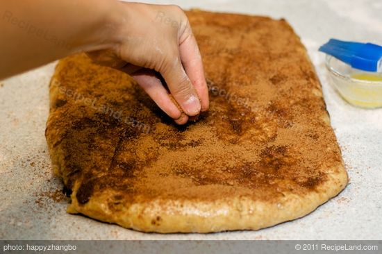 Sprinkle the cinnamon sugar evenly over the dough.