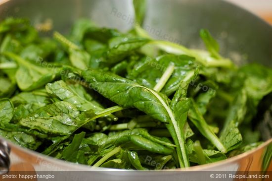 Remove the pot from the heat, and stir in the tatsoi until the leaves are witled. 