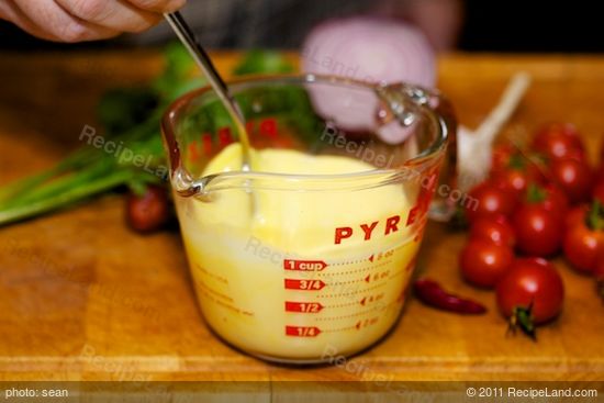Whisk the eggs and milk in a 1-cup measuring cup until well mixed. Set aside. 