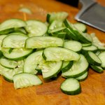 Next cut the cucumber into half-moon slices.