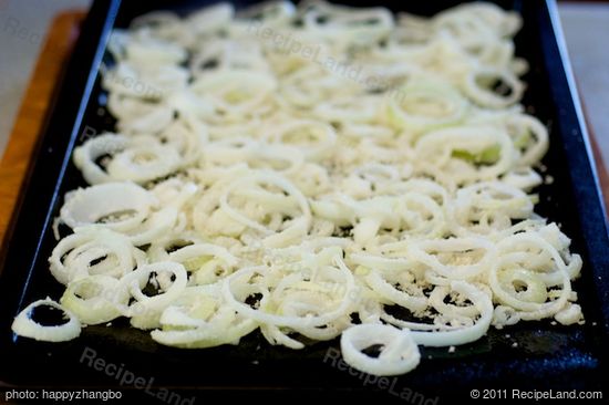 Arrange onion slices on a baking pan