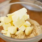 In another bowl, cream the butter and sugar.
