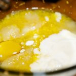 In a medium bowl, add the eggs, applesauce, yogurt, sugar and lemon zest,