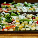 Toss the vegetables with olive oil, salt, black pepper and herbs in a large bowl, then spread onto one or two baking sheets.