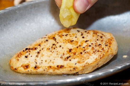 Place the chicken breasts onto a baking dish, squeeze lemon juice over.