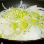 Add the leeks and onions into the pan.