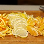 Separate the pulp and peel of oranges, thinly slice the whole lemon and orange peel.