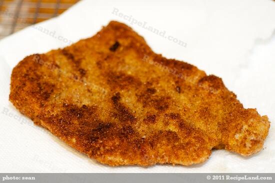Remove, drain and place on a wire rack over a sheet pan in the warm oven to keep warm while you cook the rest of the schnitzels.