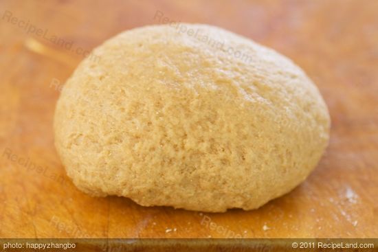 Use your hand to knead the dough a few times more until soft ball forms.